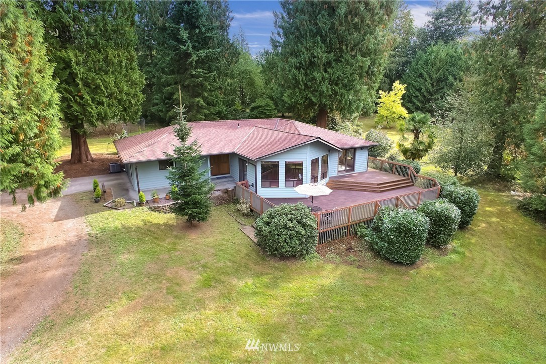 20109 Southeast 142nd Street Renton, WA 98059 - Photo 2 of 39 a front view of a house with garden