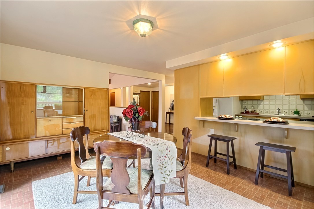 20109 Southeast 142nd Street Renton, WA 98059 - Photo 12 of 39 a view of a dining room with furniture and a window