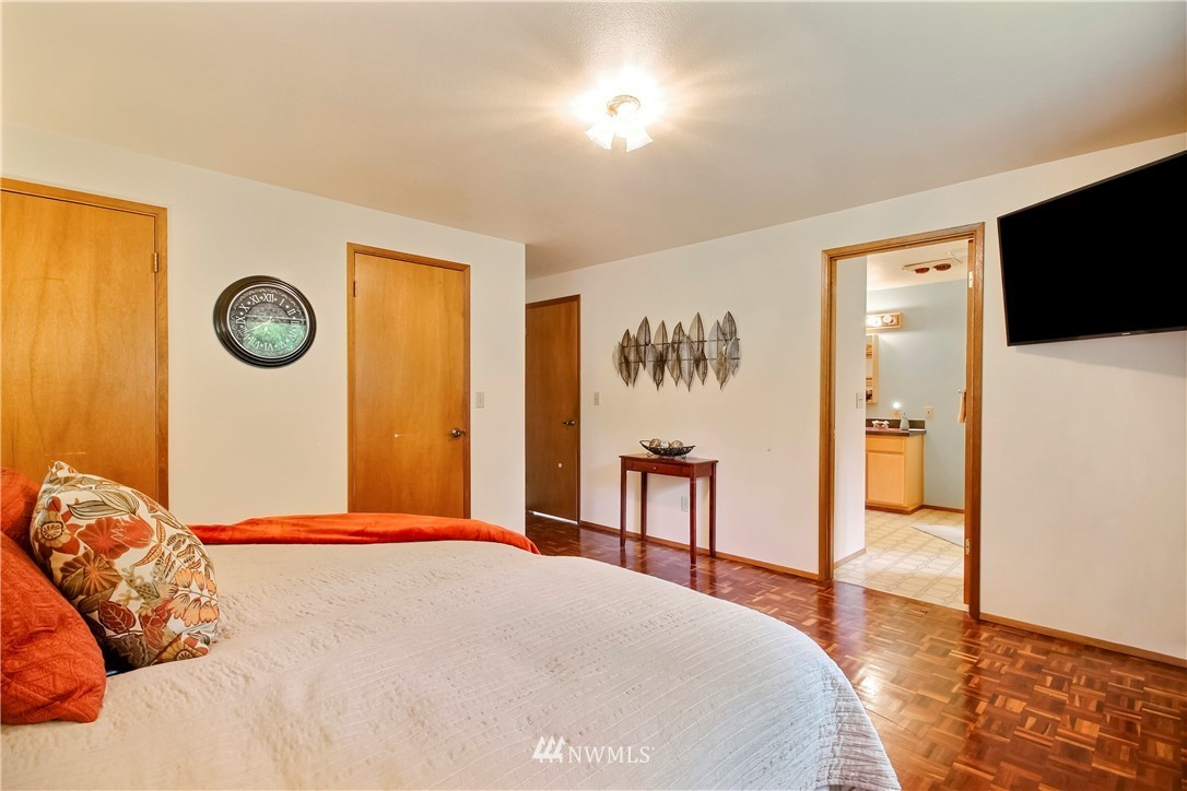 20109 Southeast 142nd Street Renton, WA 98059 - Photo 18 of 39 a bedroom with a bed and a table in it