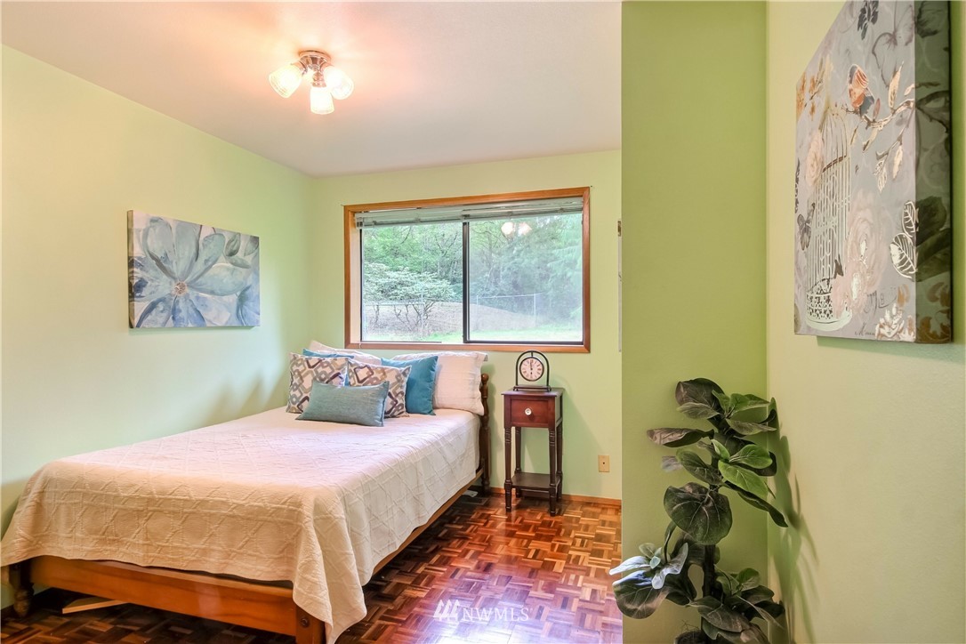 20109 Southeast 142nd Street Renton, WA 98059 - Photo 20 of 39 a bedroom with a bed and a window