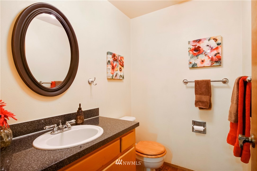 20109 Southeast 142nd Street Renton, WA 98059 - Photo 21 of 39 a bathroom with a granite countertop sink and a mirror