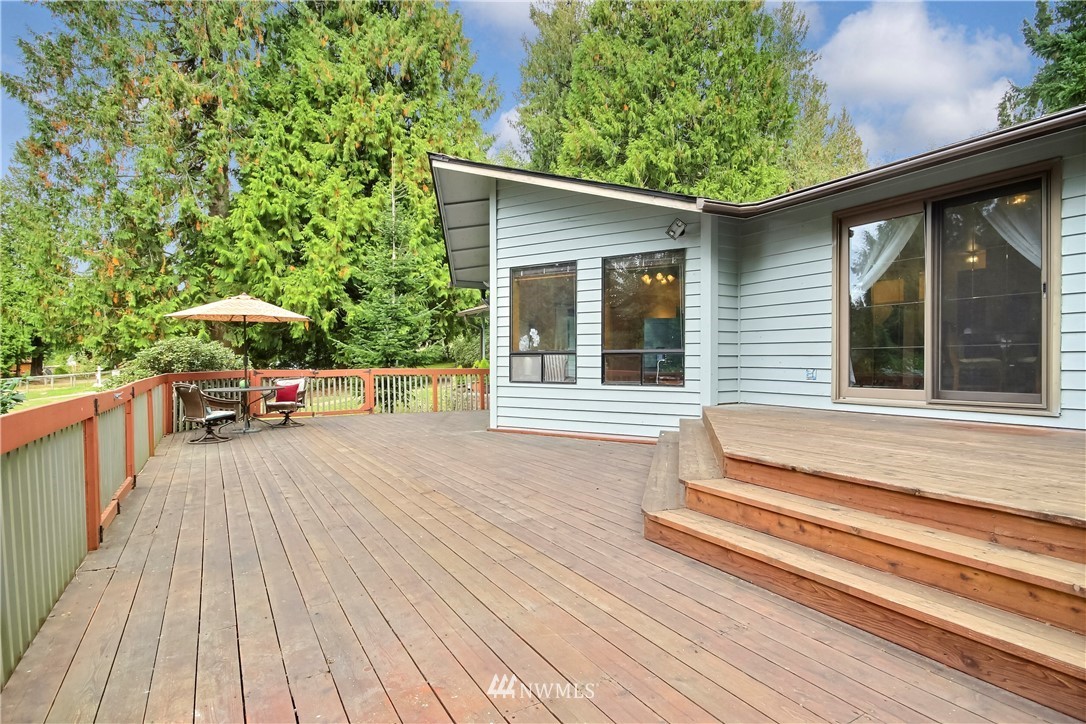 20109 Southeast 142nd Street Renton, WA 98059 - Photo 23 of 39 a view of a house with a deck