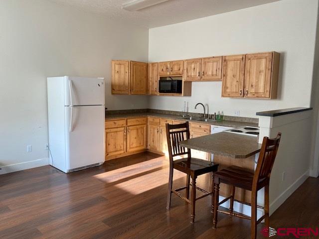 24194 Rd L Cortez, CO 81321 - Photo 19 of 30 a view of kitchen with stainless steel appliances granite countertop a dining table and chairs