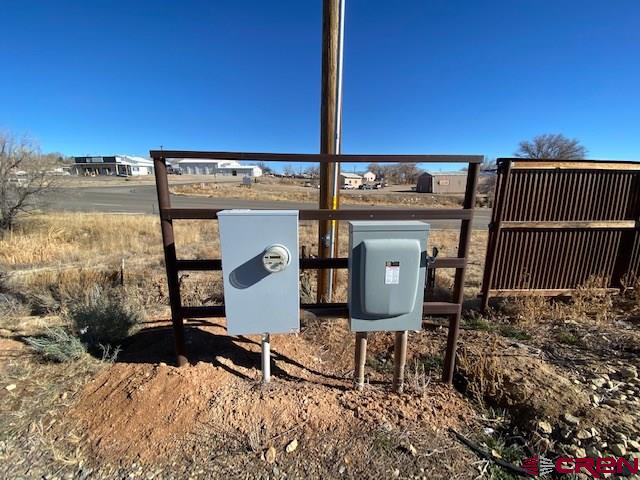 24194 Rd L Cortez, CO 81321 - Photo 30 of 30 a front view of a house with wooden fence