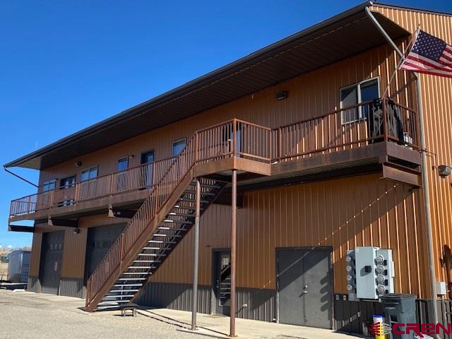 24194 Rd L Cortez, CO 81321 - Photo 4 of 30 a view of a balcony with wooden stairs