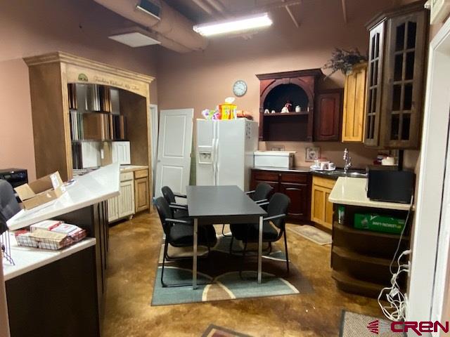 24194 Rd L Cortez, CO 81321 - Photo 8 of 30 a dining room with a table and chairs