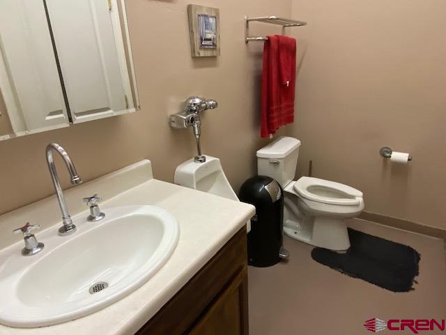 24194 Rd L Cortez, CO 81321 - Photo 9 of 30 a bathroom with a sink and a toilet