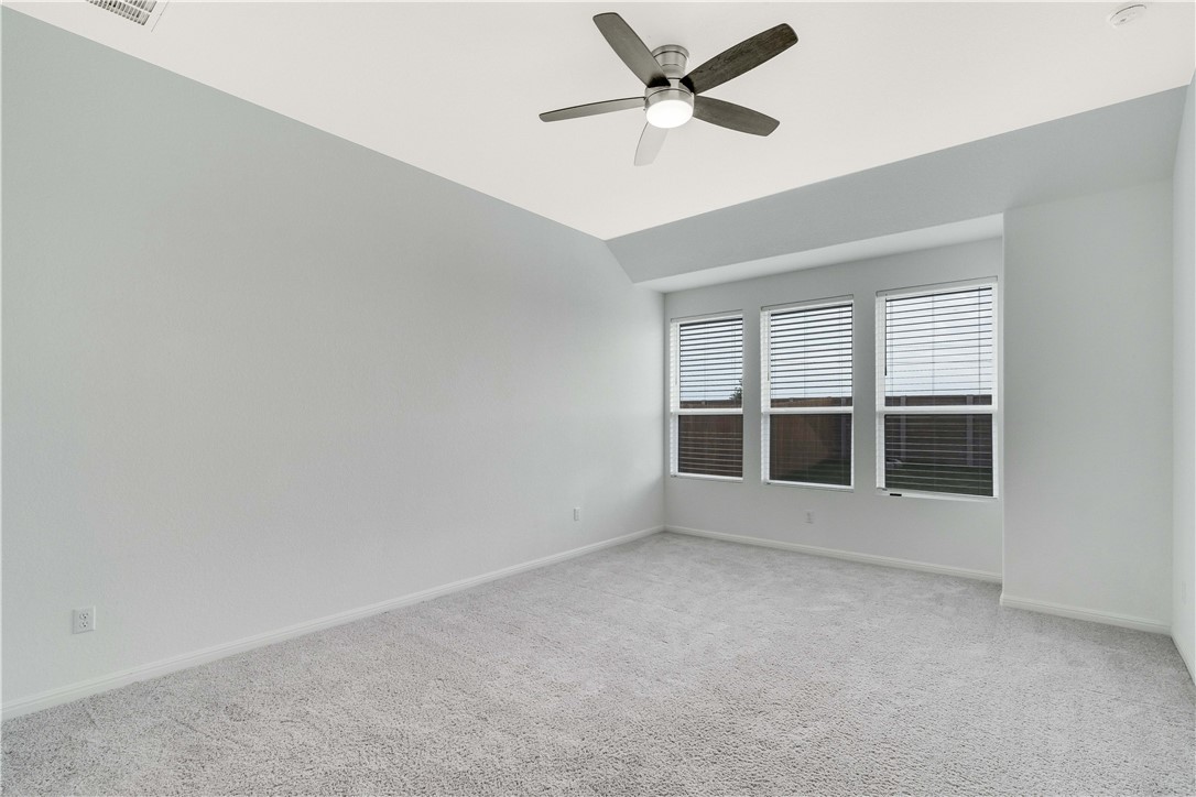 17629 Shafer Drive Pflugerville, TX 78660 - Photo 13 of 35 an empty room with a empty space and windows