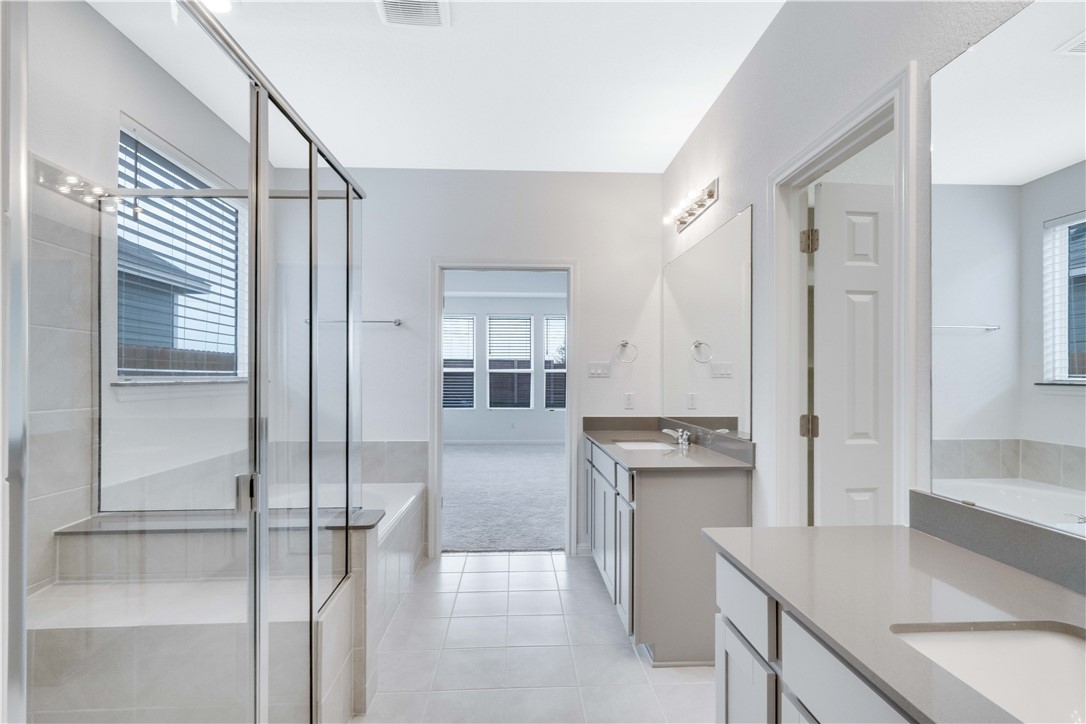 17629 Shafer Drive Pflugerville, TX 78660 - Photo 15 of 35 a kitchen with kitchen island a counter top space a sink and refrigerator