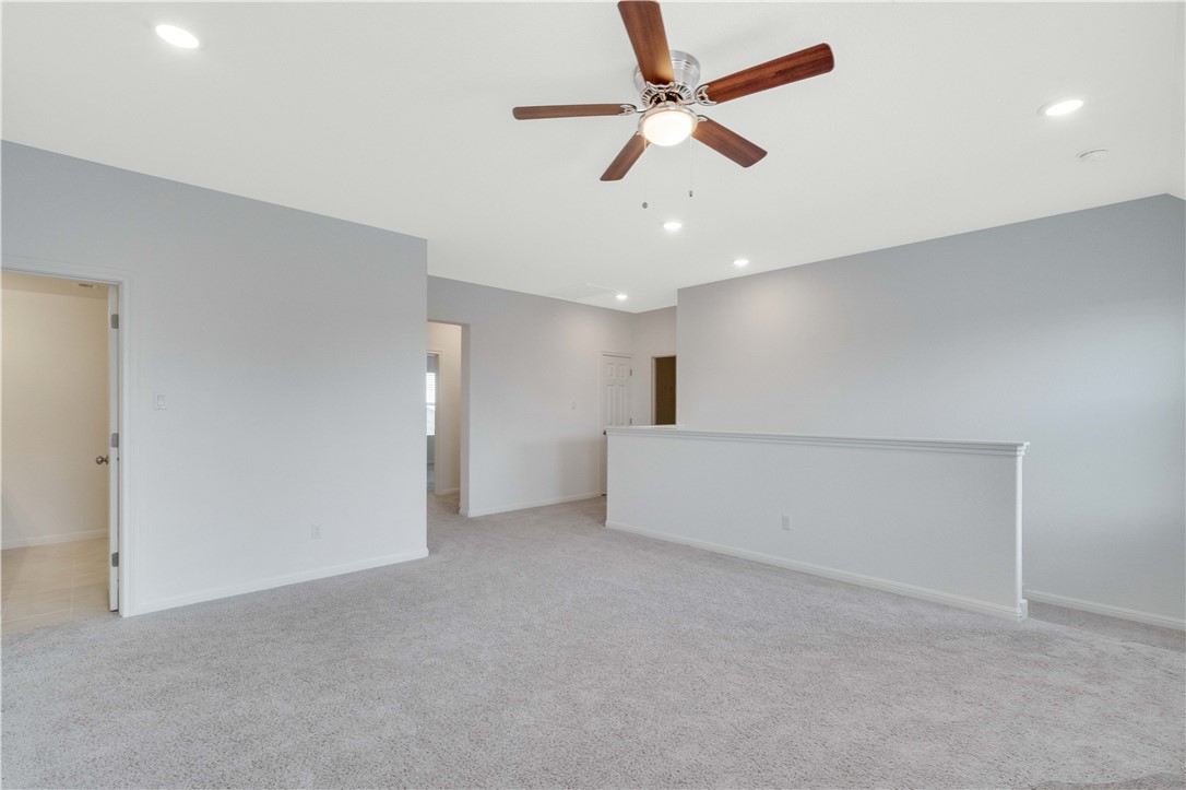 17629 Shafer Drive Pflugerville, TX 78660 - Photo 17 of 35 an empty room with ceiling fan and window