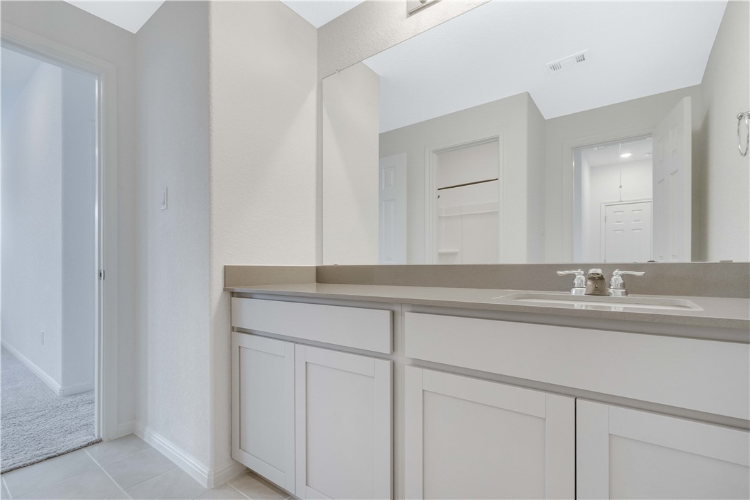 17629 Shafer Drive Pflugerville, TX 78660 - Photo 26 of 35 a bathroom with a sink and a mirror
