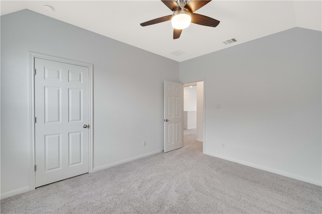 17629 Shafer Drive Pflugerville, TX 78660 - Photo 29 of 35 an empty room with windows and fan
