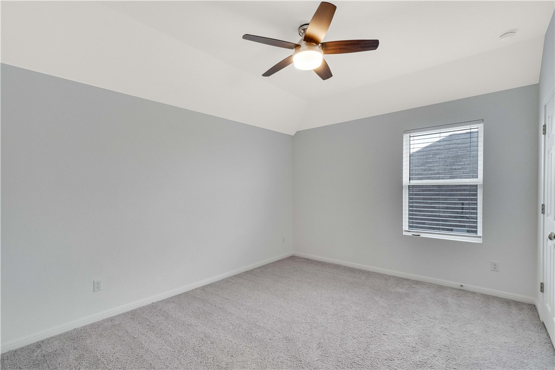 17629 Shafer Drive Pflugerville, TX 78660 - Photo 30 of 35 an empty room with a window and a fan