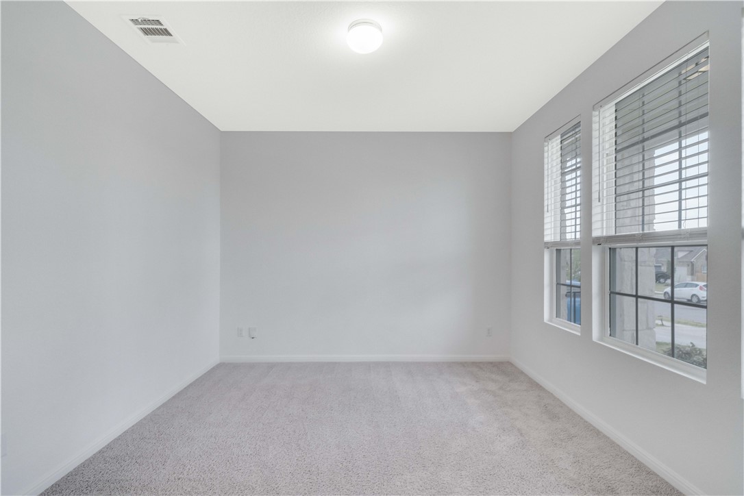 17629 Shafer Drive Pflugerville, TX 78660 - Photo 5 of 35 an empty room with windows