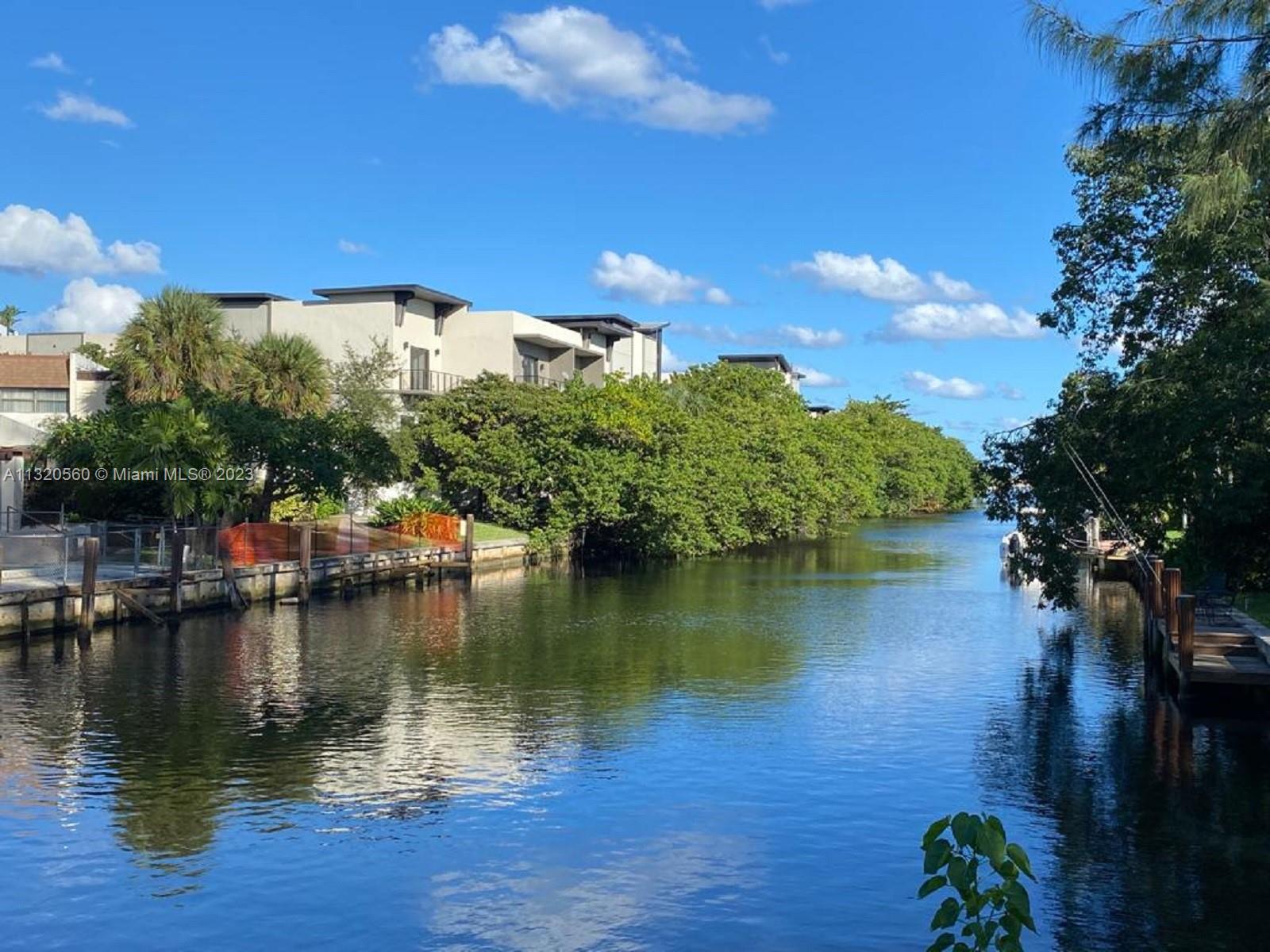 134 South Cypress Road, Unit 421 Pompano Beach, FL 33060 - Photo 11 of 12 a view of a lake with a yard