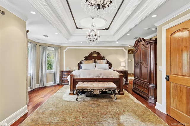 a living room with furniture a table and wooden floor