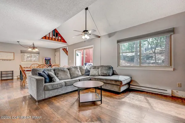 a living room with furniture and a large window