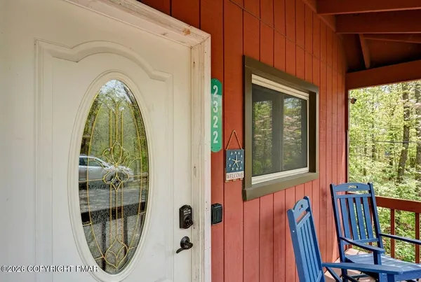 a view of a entryway door with wooden floor