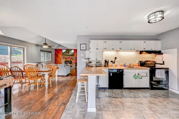 a kitchen with a table and chairs in it