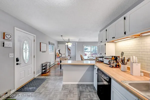 a kitchen with counter top space and sink