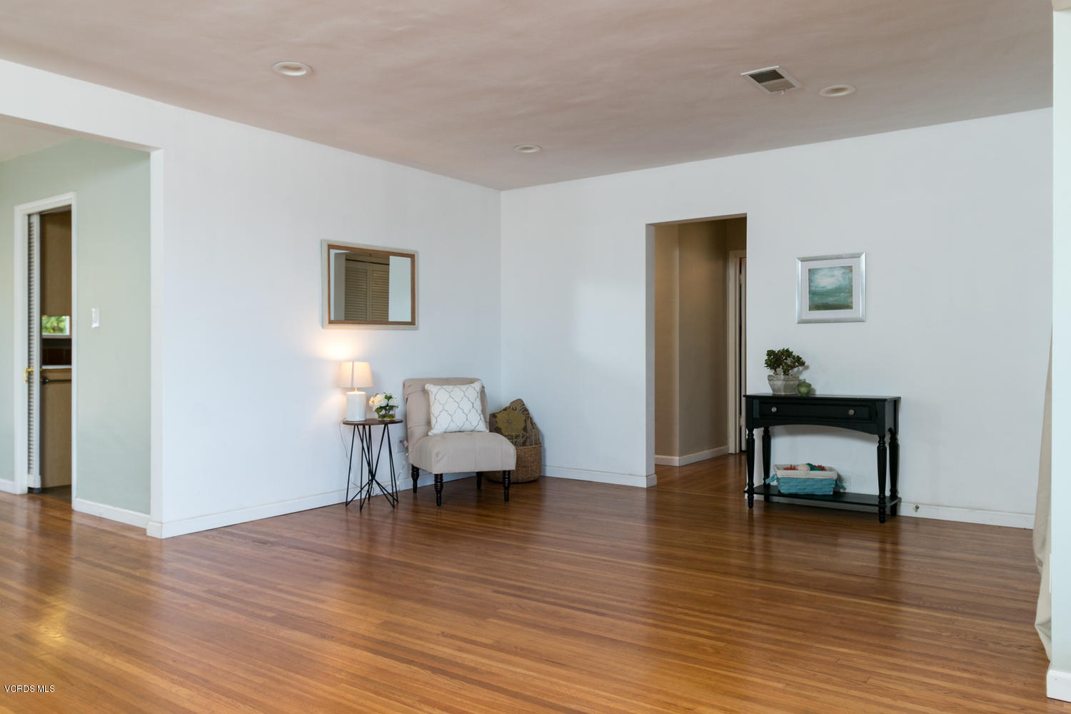 3263 Foothill Road Ventura, CA 93003 - Photo 8 of 26 a living room with furniture and a wooden floor