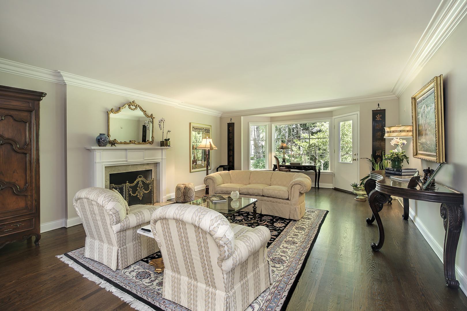 105 Woodley Road Winnetka, IL 60093 - Photo 3 of 23 a living room with furniture large window and fireplace