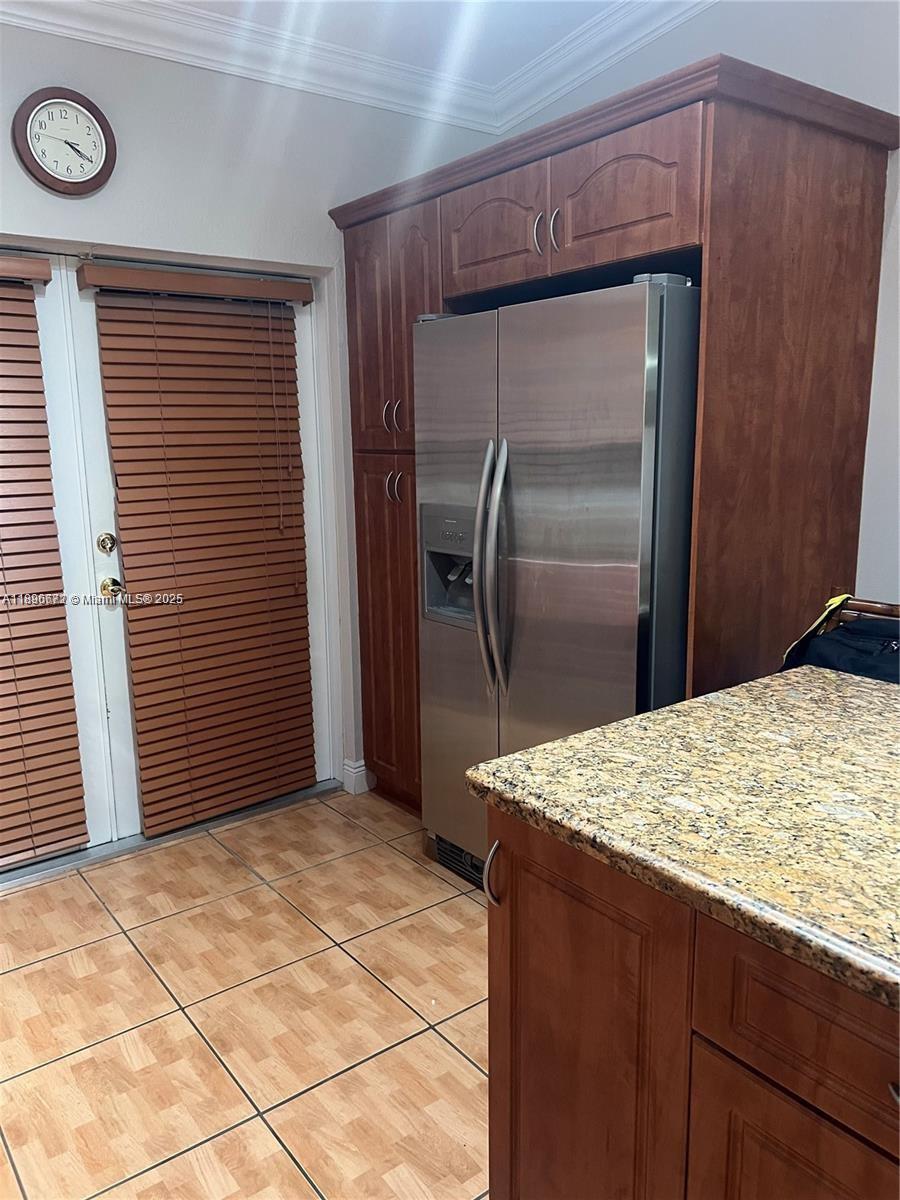 7667 Northwest 182nd Lane, Unit 805 Hialeah, FL 33015 - Photo 5 of 14 a kitchen with a refrigerator and a sink