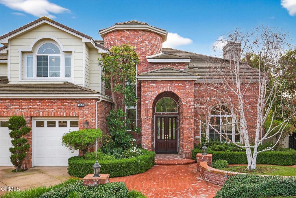 5352 Plata Rosa Court Camarillo, CA 93012 - Photo 11 of 75 a front view of a house with garden