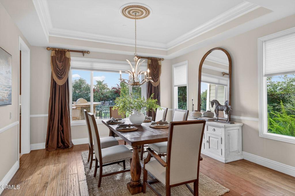 5352 Plata Rosa Court Camarillo, CA 93012 - Photo 17 of 75 a dining room with furniture a chandelier and wooden floor