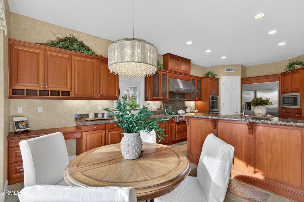 5352 Plata Rosa Court Camarillo, CA 93012 - Photo 30 of 75 a view of a dining room with furniture a kitchen and chandelier