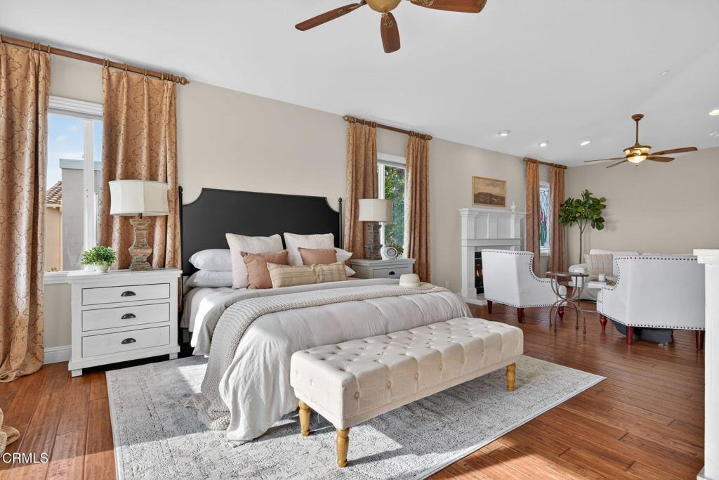 5352 Plata Rosa Court Camarillo, CA 93012 - Photo 37 of 75 a spacious bedroom with a bed a couch and large window