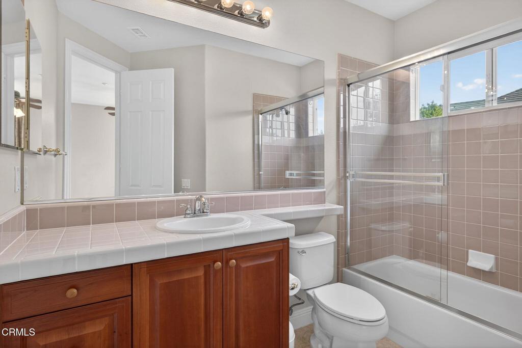 5352 Plata Rosa Court Camarillo, CA 93012 - Photo 50 of 75 a bathroom with a granite countertop sink toilet and shower