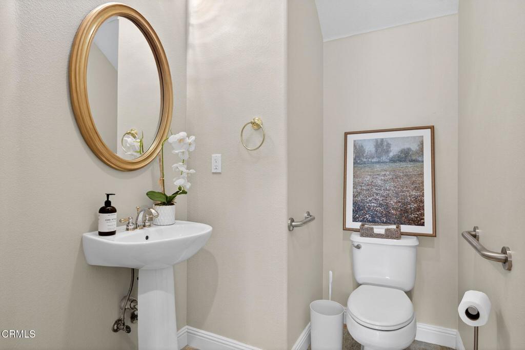 5352 Plata Rosa Court Camarillo, CA 93012 - Photo 55 of 75 a bathroom with a toilet a sink and a mirror