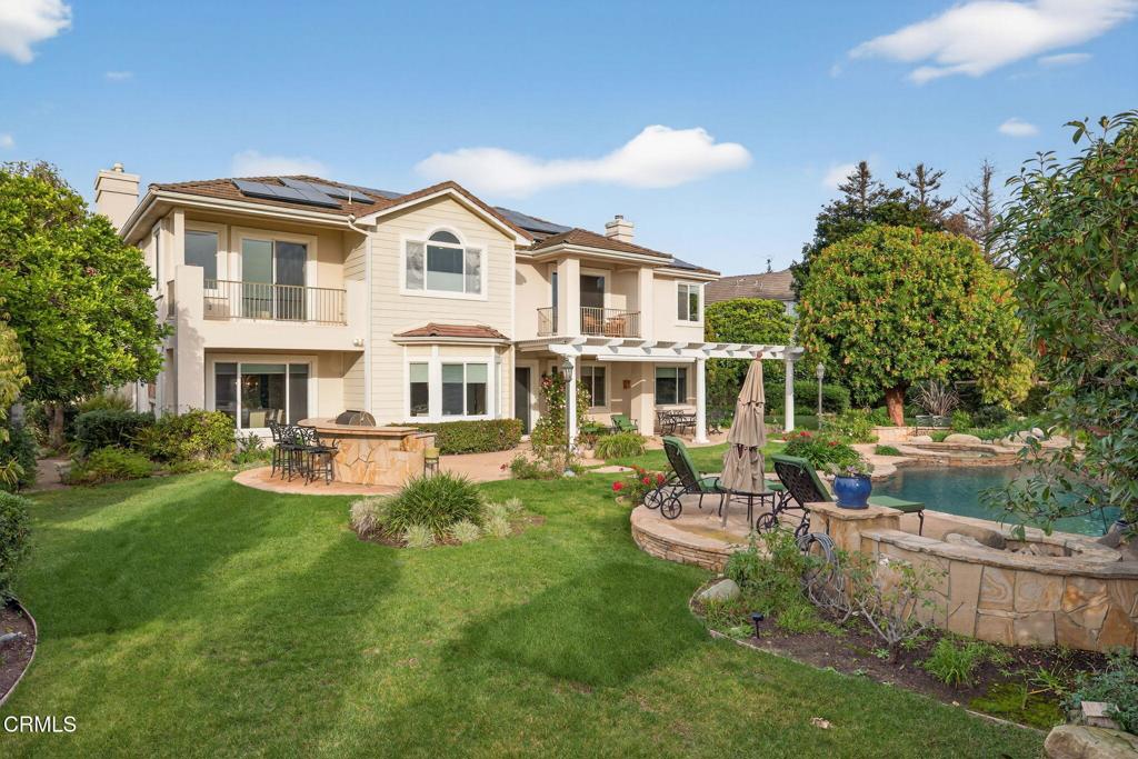 5352 Plata Rosa Court Camarillo, CA 93012 - Photo 59 of 75 a front view of a house with a yard table and chairs