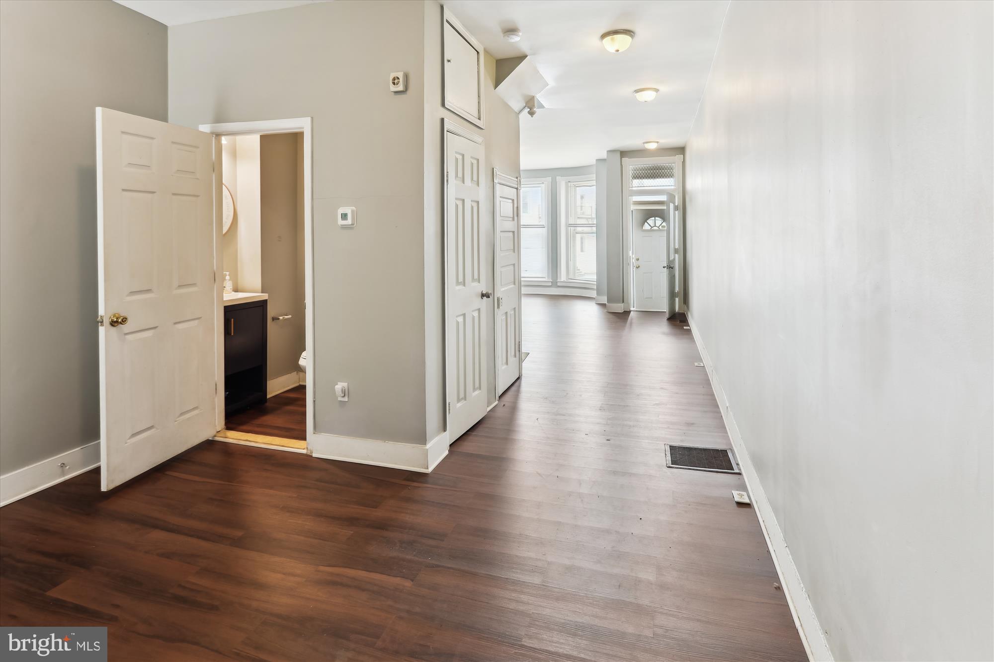 2315 McCulloh Street Baltimore, MD 21217 - Photo 6 of 40 a view of a hallway with wooden floor