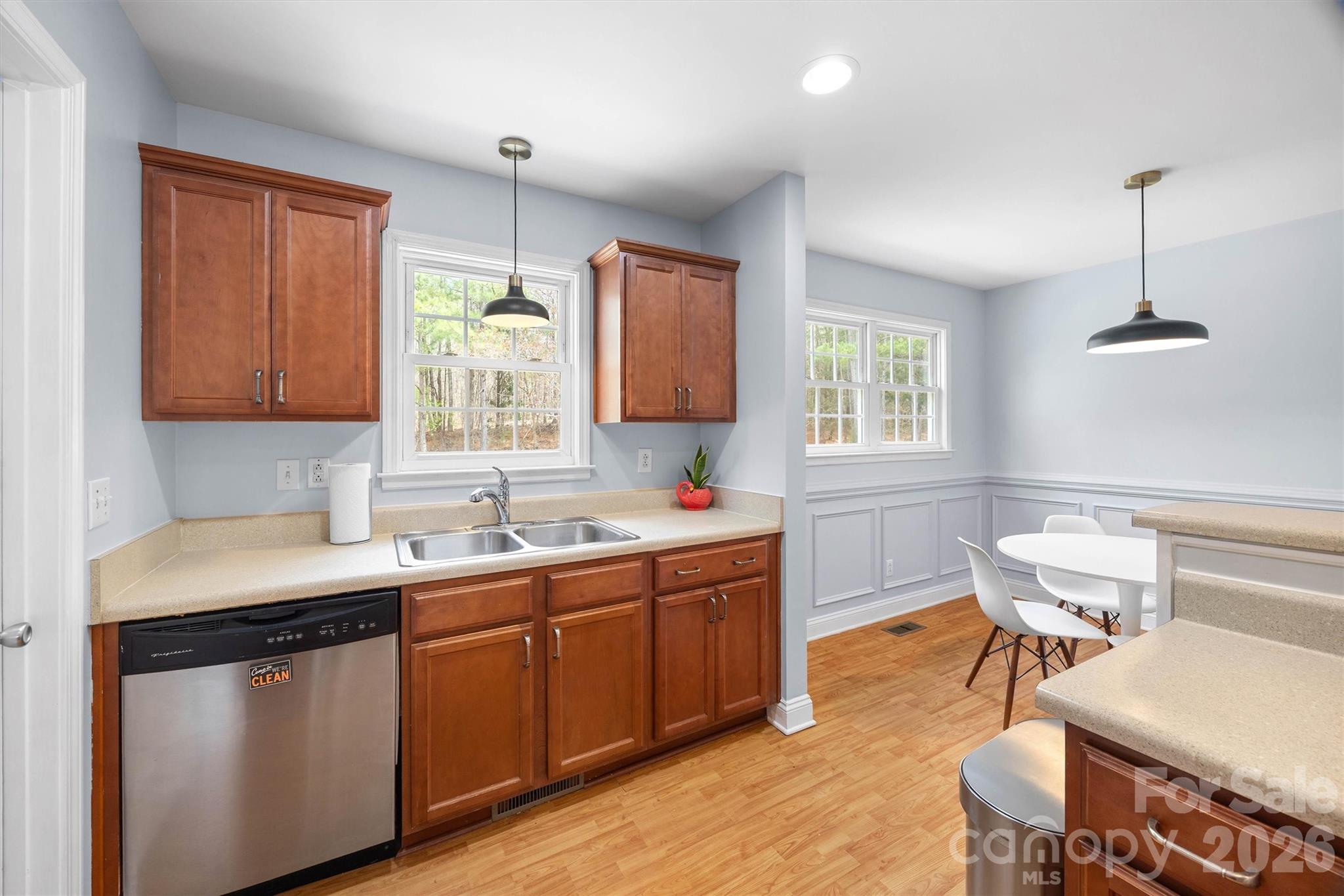 219 Nottingham Street York, SC 29745 - Photo 13 of 38 a kitchen with a sink cabinets and wooden floor