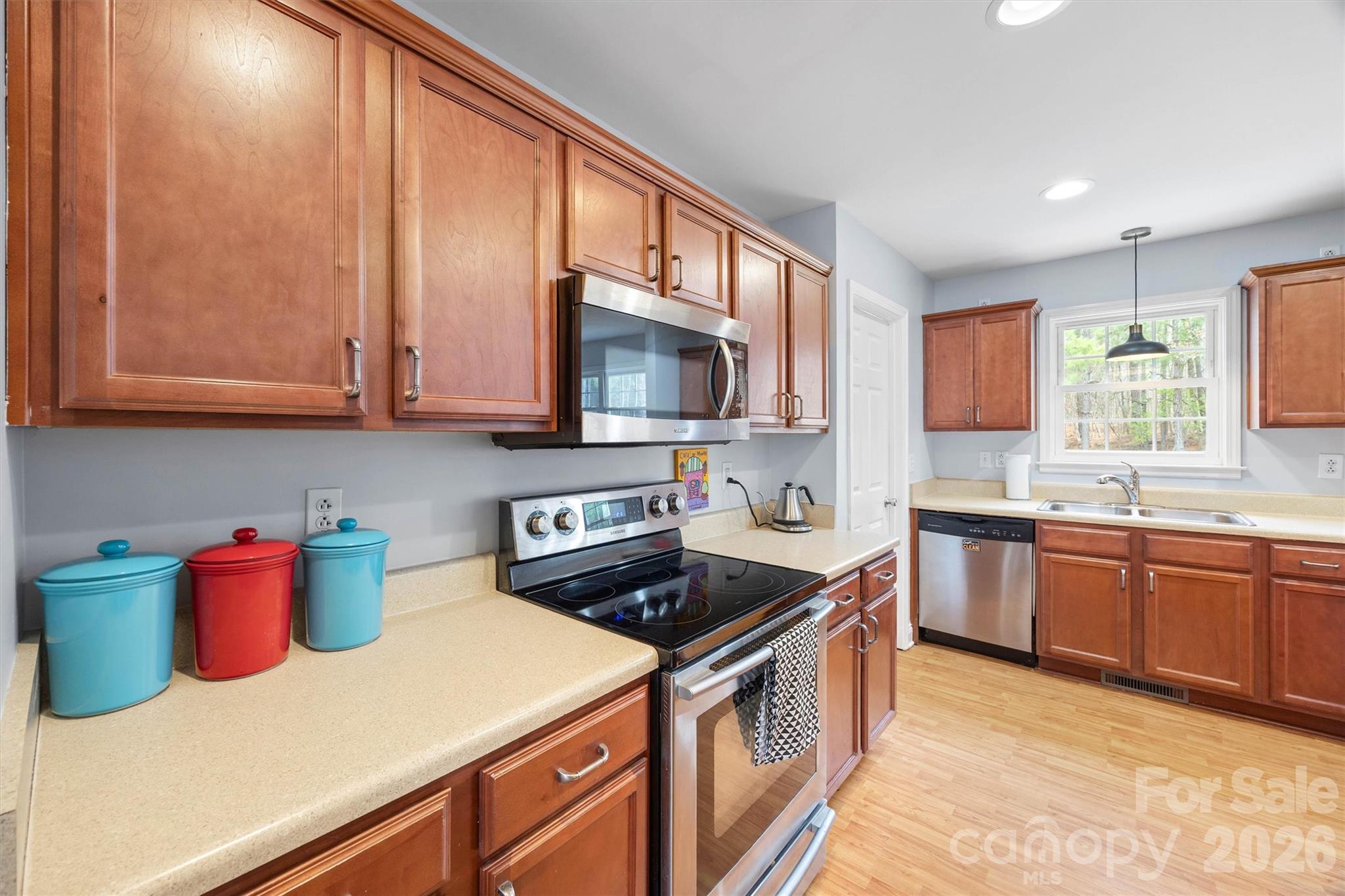 219 Nottingham Street York, SC 29745 - Photo 14 of 38 a kitchen with stainless steel appliances granite countertop a sink stove and cabinets