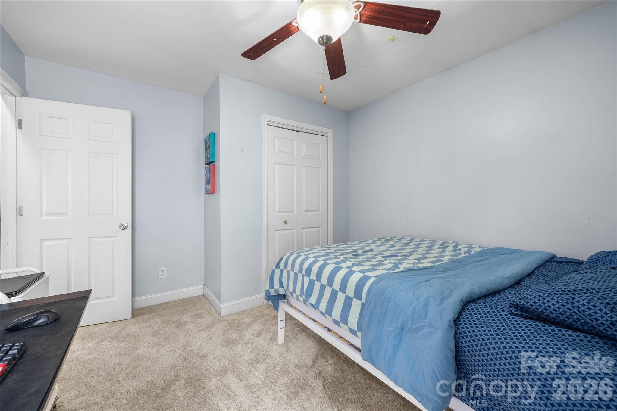 219 Nottingham Street York, SC 29745 - Photo 17 of 38 a bedroom with a bed and a chandelier