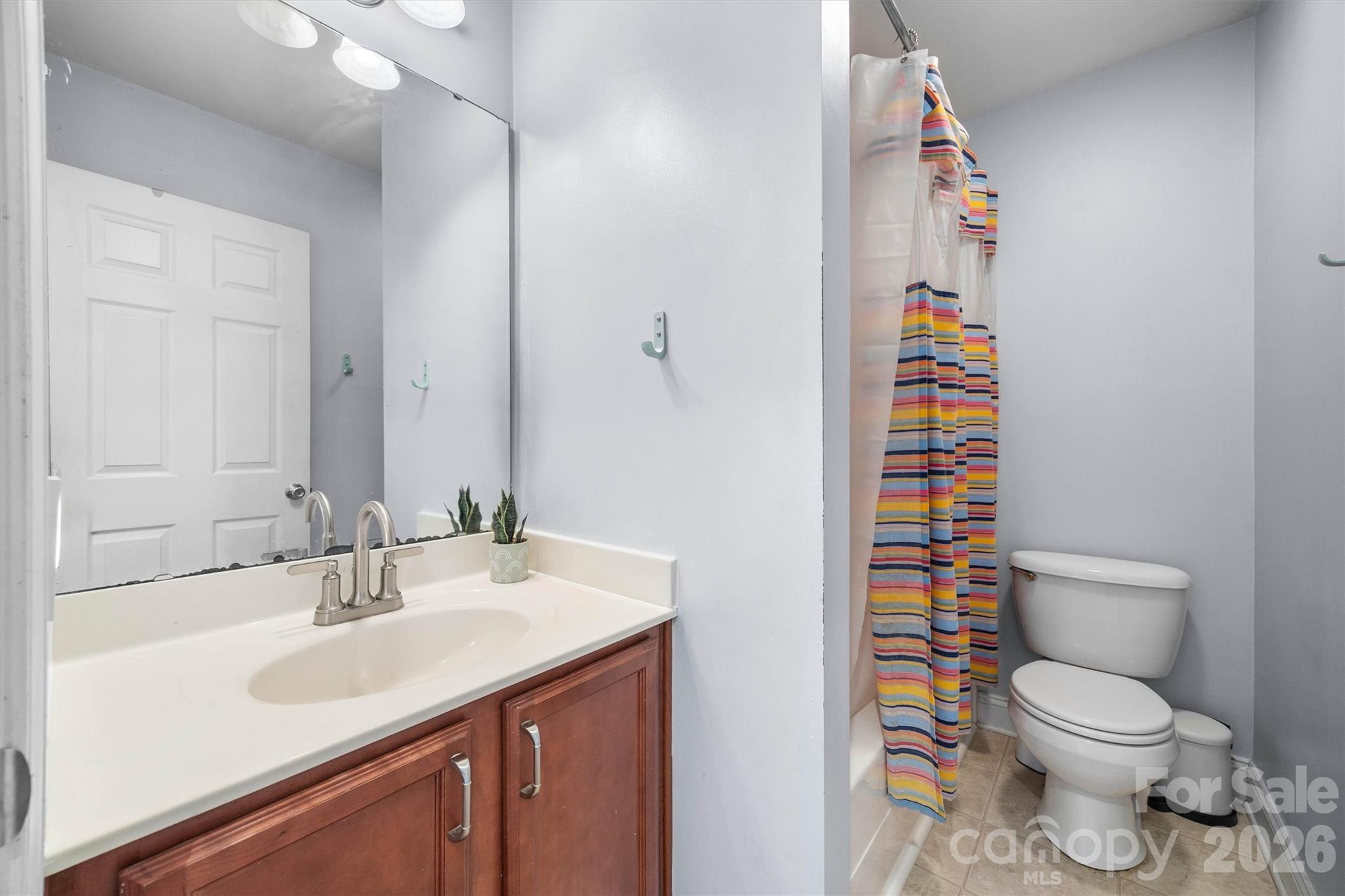 219 Nottingham Street York, SC 29745 - Photo 18 of 38 a bathroom with a sink toilet and shower