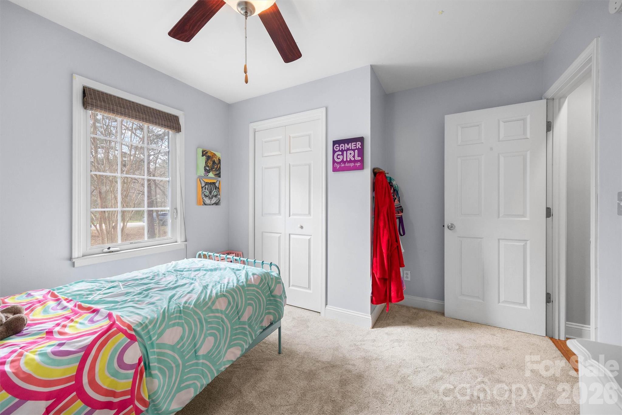 219 Nottingham Street York, SC 29745 - Photo 20 of 38 a bedroom with a bed and a chandelier