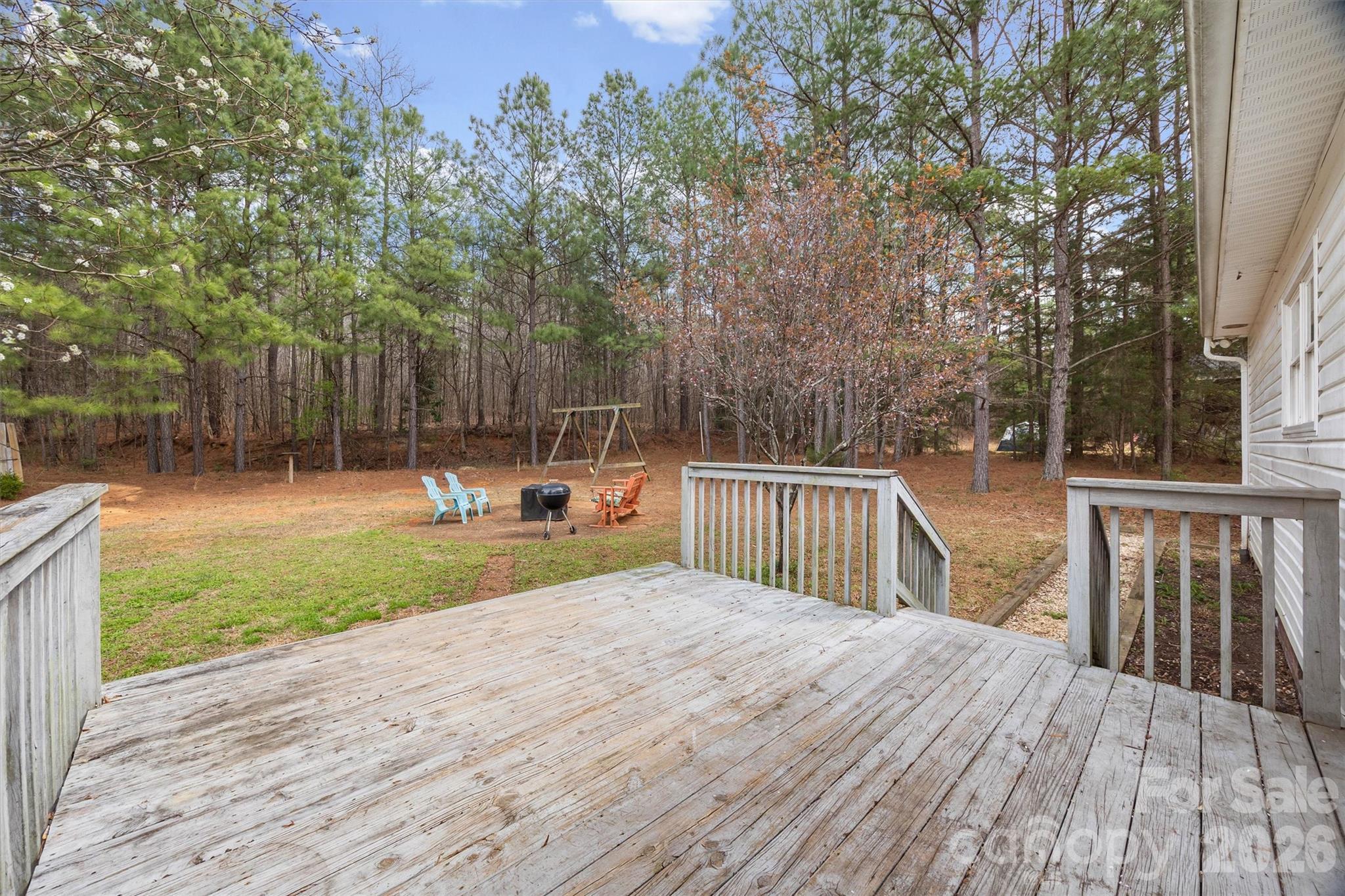 219 Nottingham Street York, SC 29745 - Photo 23 of 38 a view of a backyard with sitting area and tree s