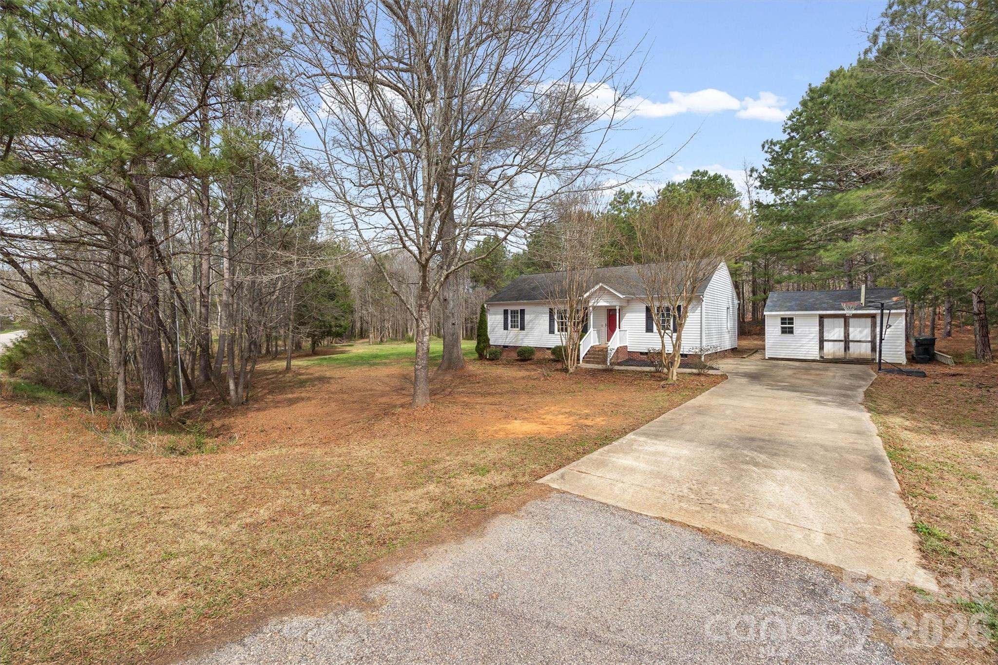 219 Nottingham Street York, SC 29745 - Photo 30 of 38 a house with trees in front of it