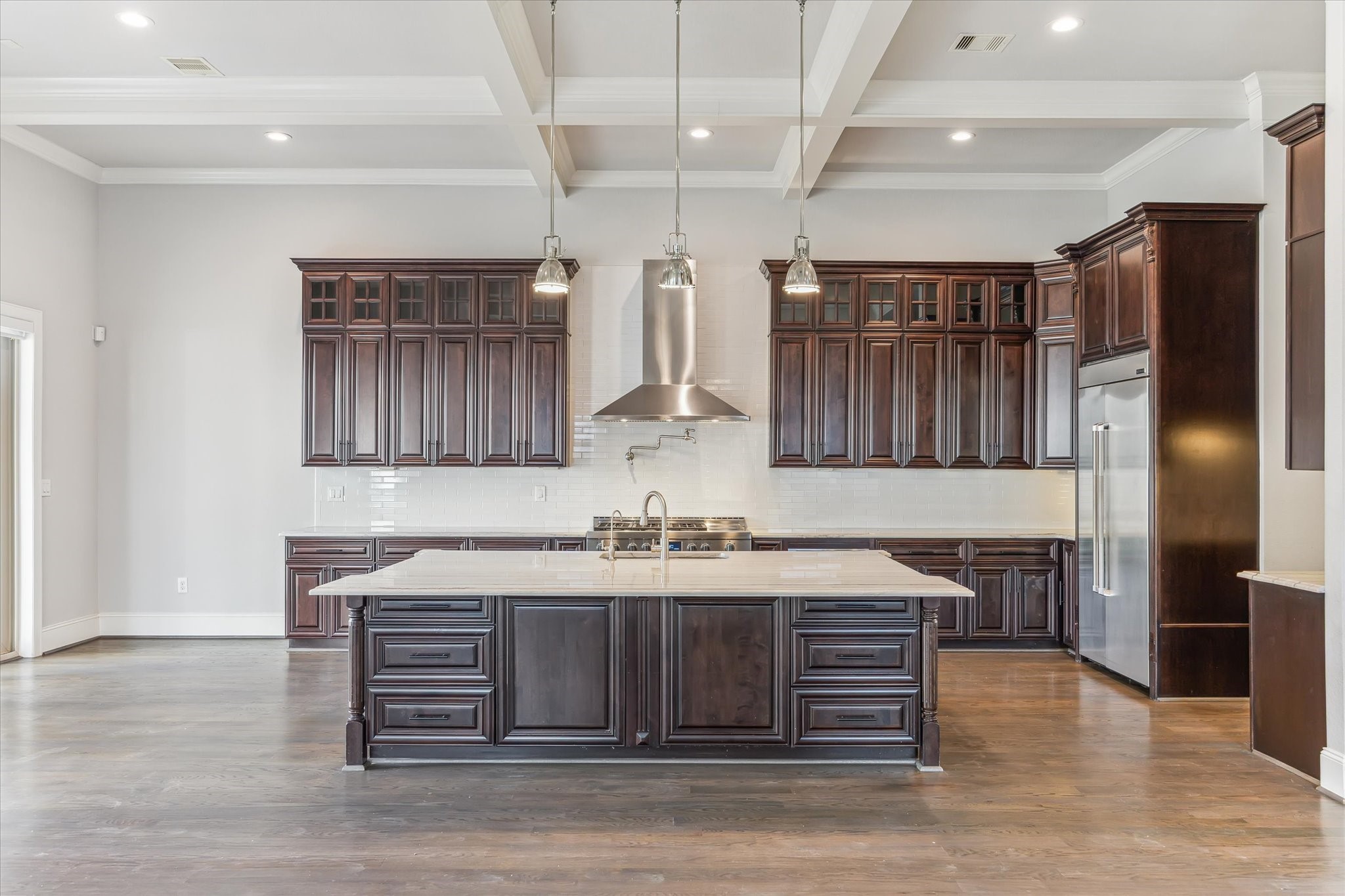 1721 Colquitt Street Houston, TX 77098 - Photo 12 of 30 a kitchen with kitchen island a counter top space cabinets and stainless steel appliances
