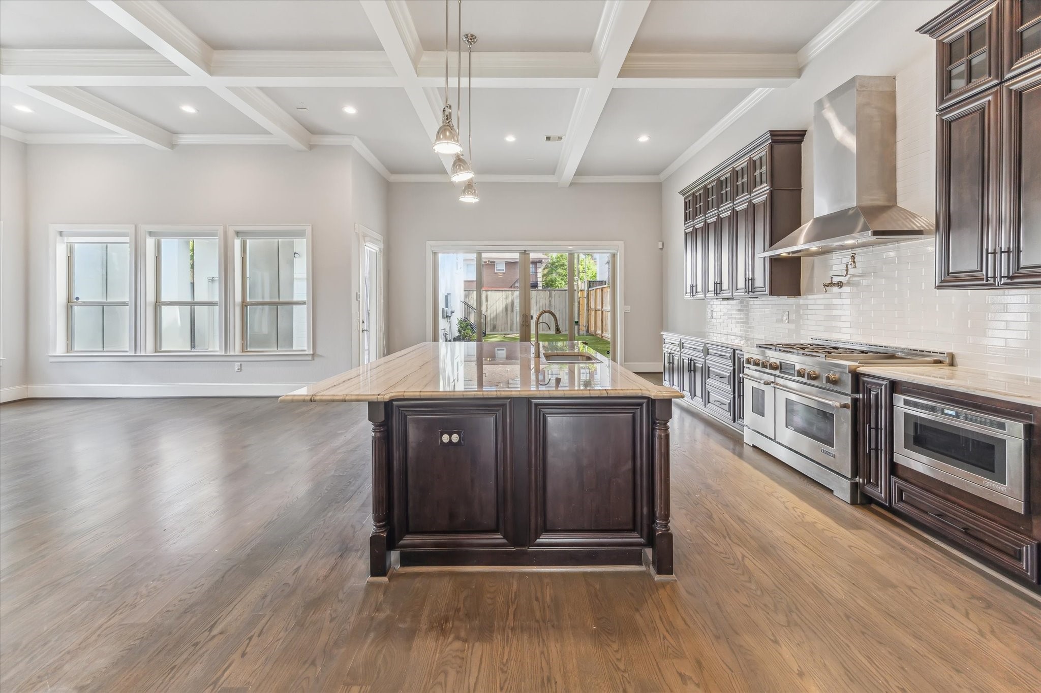 1721 Colquitt Street Houston, TX 77098 - Photo 13 of 30 a kitchen with stainless steel appliances granite countertop a stove a sink dishwasher and a microwave oven with wooden floor