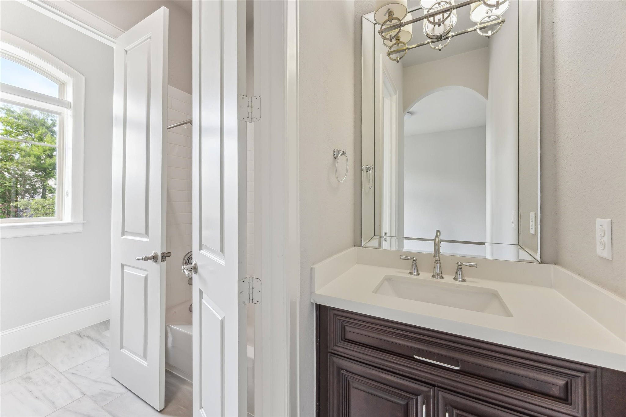 1721 Colquitt Street Houston, TX 77098 - Photo 19 of 30 a bathroom with a sink and a mirror