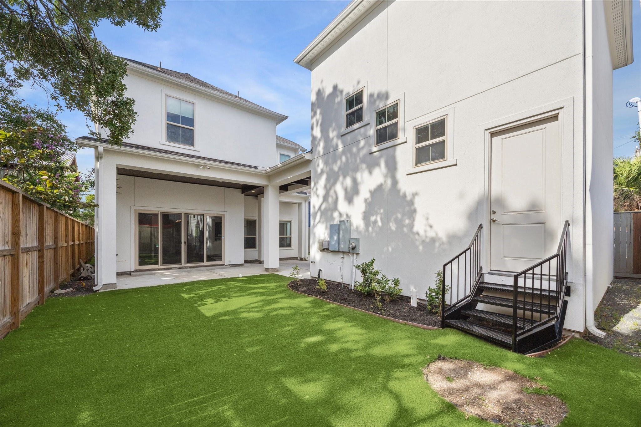 1721 Colquitt Street Houston, TX 77098 - Photo 28 of 30 a view of a house with a yard and pathway