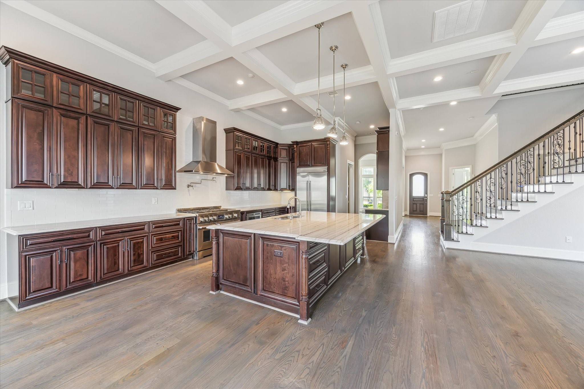 1721 Colquitt Street Houston, TX 77098 - Photo 9 of 30 a large kitchen with stainless steel appliances granite countertop a large stove a sink dishwasher and wooden cabinets with wooden floor