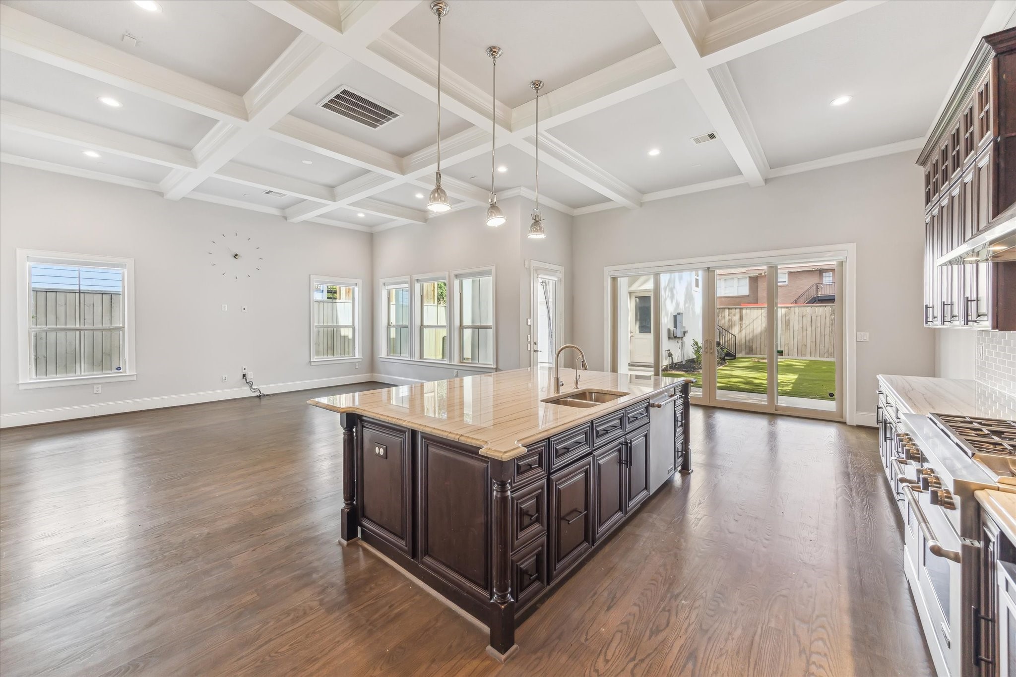 1721 Colquitt Street Houston, TX 77098 - Photo 10 of 30 a spacious kitchen with stainless steel appliances granite countertop a lot of counter space and wooden floors