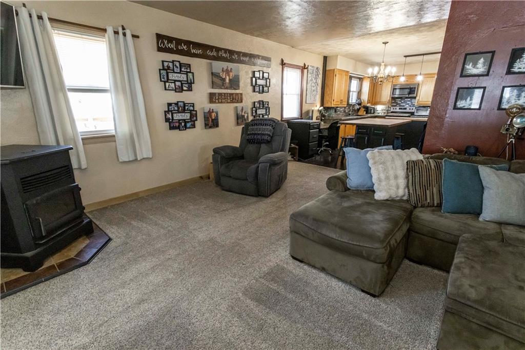 842 Anderson Street Confluence, PA 15424 - Photo 11 of 43 a living room with furniture and a fireplace