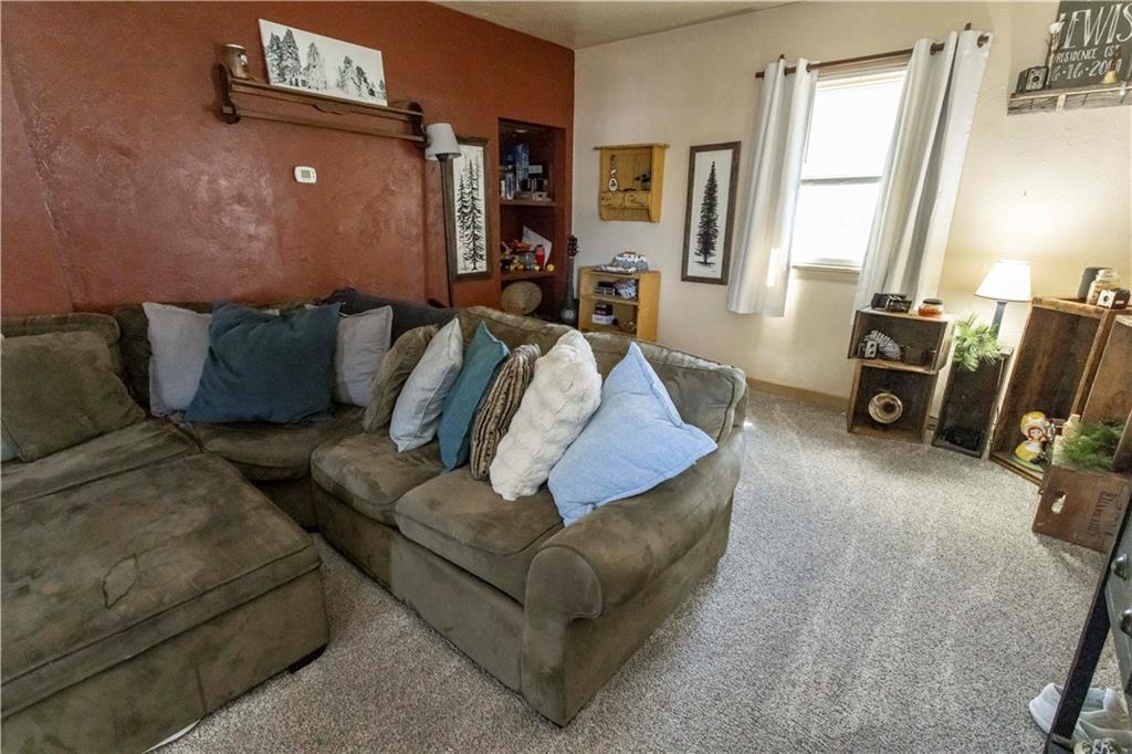 842 Anderson Street Confluence, PA 15424 - Photo 12 of 43 a living room with furniture and a flat screen tv